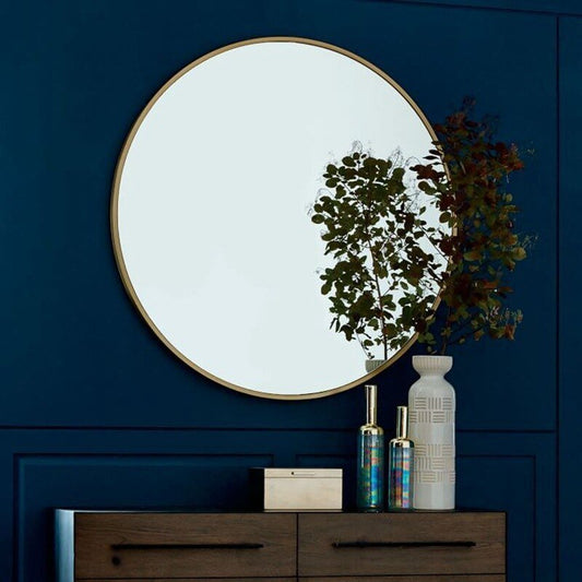 stylish 30cm round mirror on dark blue background