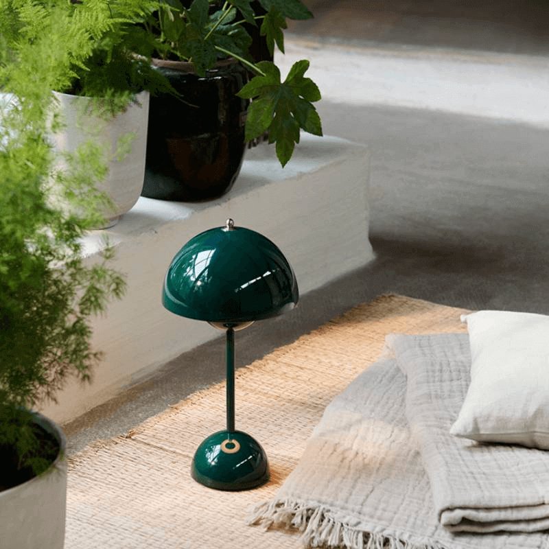 flowerpot vp9 portable rechargeable lamp in dark green backyard setting with plants