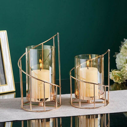 Golden Candle holder, on a table with green background. shipped for free at Malones