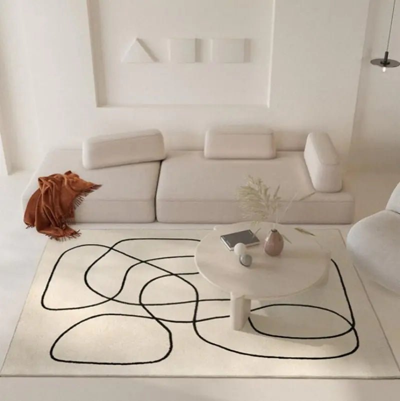 Modern white area rug adorned with bold black curved lines, soft texture, statement piece for homes