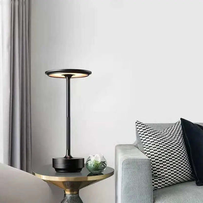 Small Table Lamps | indoor/ outdoor. Black lamp sitting on end table beside a couch with Grey background.